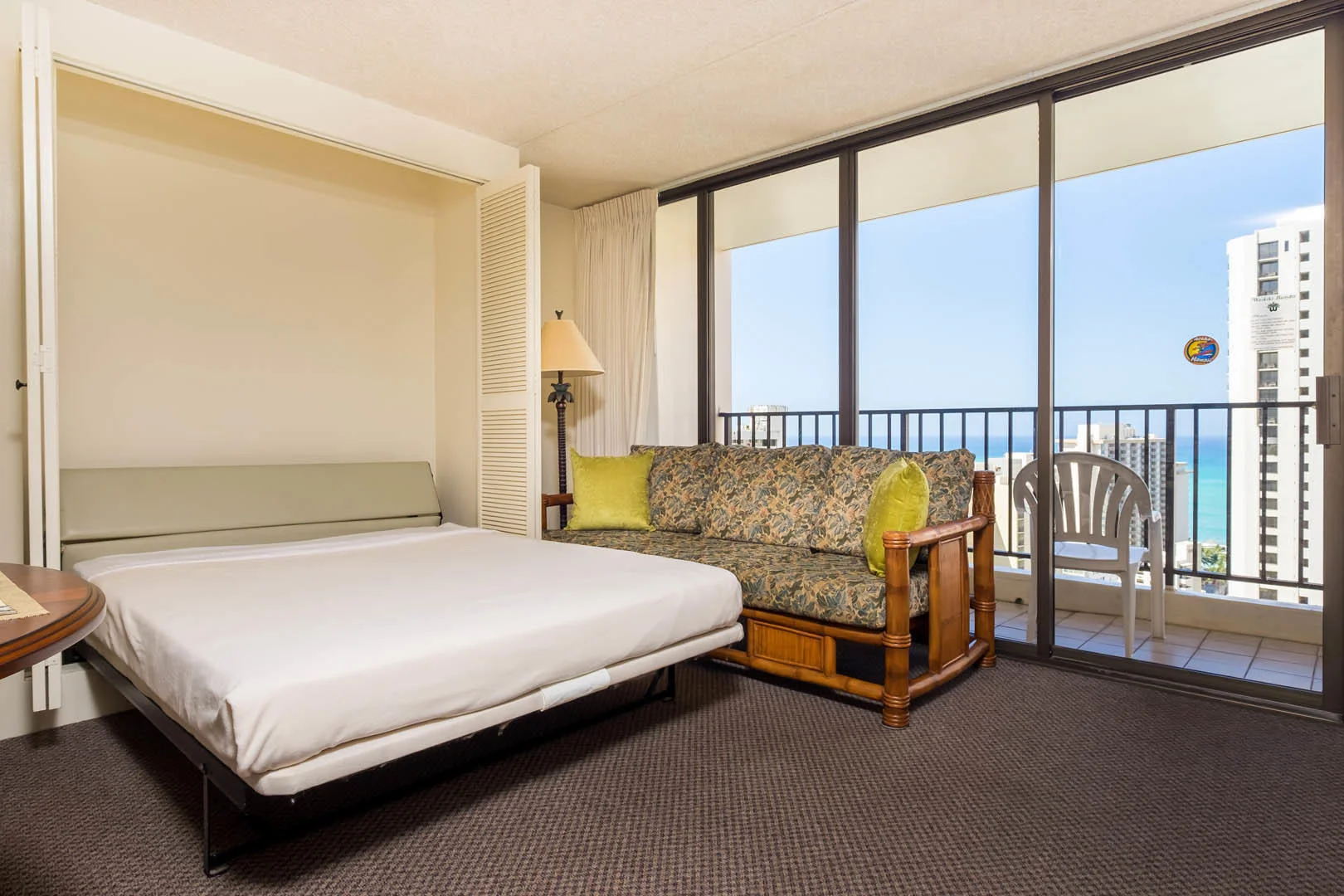 Hawaiian Sun Holidays at The Waikiki Banyan Living Room Murphy Bed